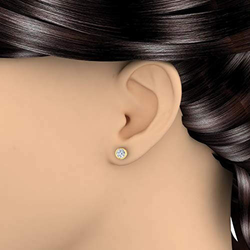 Gold diamond stud earring on mannequin.
