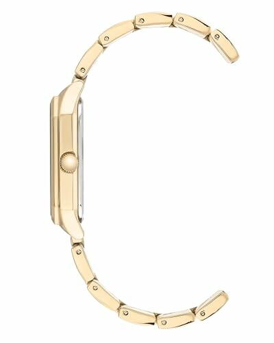 Side view of a gold wristwatch with a metal band