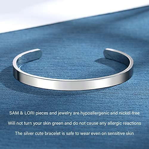 Silver cuff bracelet on blue surface with text about hypoallergenic features.