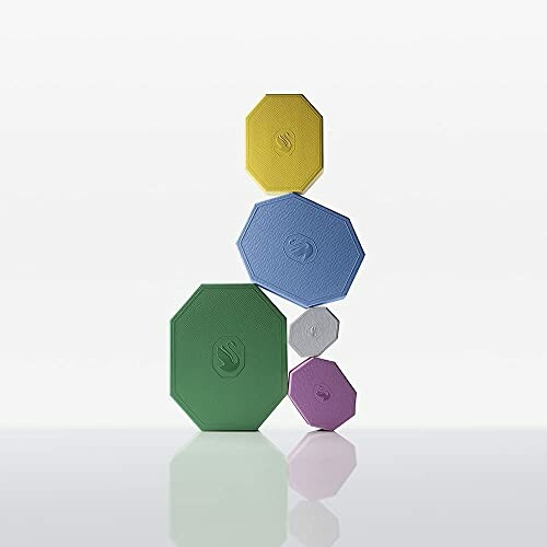 Stacked colorful geometric shapes against a plain background.