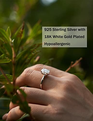 Hand wearing a 925 sterling silver ring with 18K white gold plating, surrounded by green leaves.